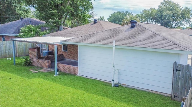 208 Magnolia Ave, La Place, LA 70068 - view of home's exterior featuring a shingled roof