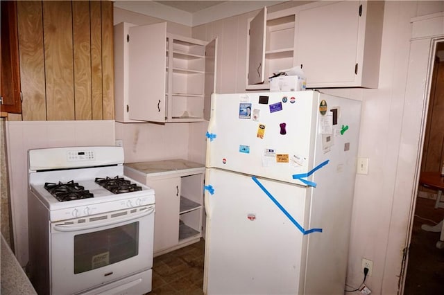 382426 Royal St, New Orleans, LA 70117 - kitchen with white appliances, open shelves, light countertops, and white cabinets