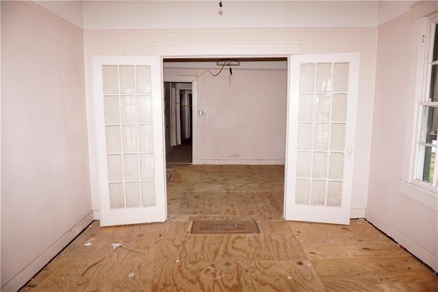 382426 Royal St, New Orleans, LA 70117 - corridor with french doors and baseboards