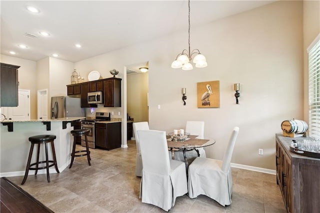 724 Fairfield Loop, Slidell, LA 70458 - dining area with a chandelier, baseboards, and recessed lighting