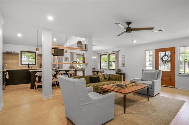 601 Andrews Ave, Metairie, LA 70005 - living room with healthy amount of natural light, light wood-type flooring, ceiling fan, and recessed lighting