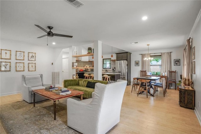 601 Andrews Ave, Metairie, LA 70005 - living room with light wood finished floors, recessed lighting, ceiling fan, and baseboards