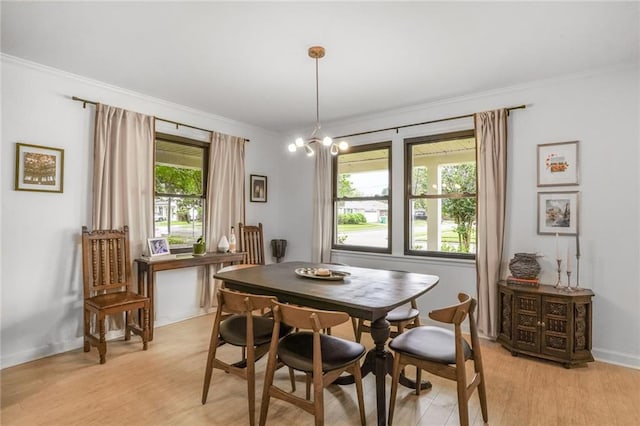 601 Andrews Ave, Metairie, LA 70005 - dining room featuring ornamental molding, light wood finished floors, and baseboards