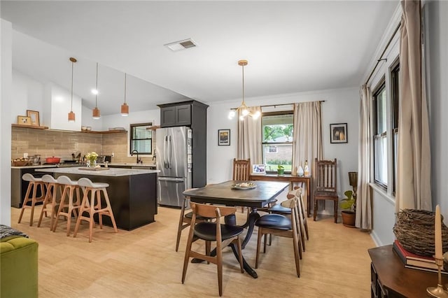 601 Andrews Ave, Metairie, LA 70005 - dining space featuring vaulted ceiling