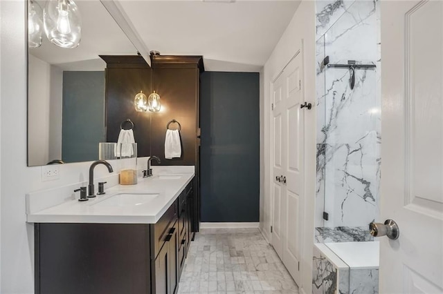 601 Andrews Ave, Metairie, LA 70005 - bathroom featuring marble look tiles, double vanity, and a marble finish shower