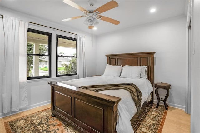 601 Andrews Ave, Metairie, LA 70005 - bedroom featuring light wood-style flooring, a ceiling fan, and recessed lighting