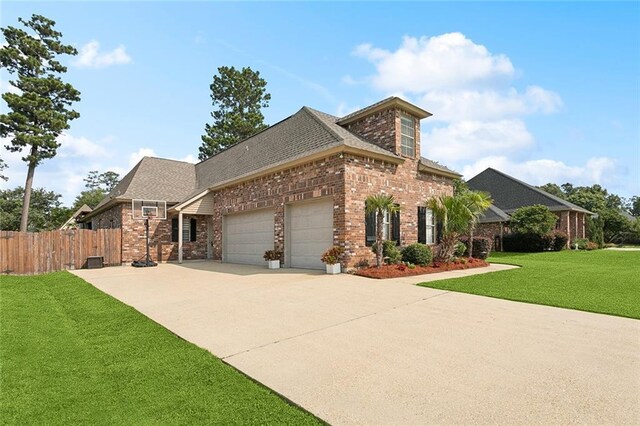 1037 Scarlet Oak Ln, Mandeville, LA 70448 - view of front of home with brick siding, an attached garage, roof with shingles, and concrete driveway