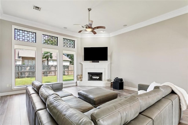 1037 Scarlet Oak Ln, Mandeville, LA 70448 - living area with a ceiling fan, ornamental molding, baseboards, and wood finished floors