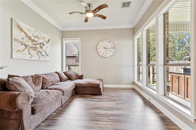 1037 Scarlet Oak Ln, Mandeville, LA 70448 - living area featuring a ceiling fan, wood finished floors, crown molding, and baseboards