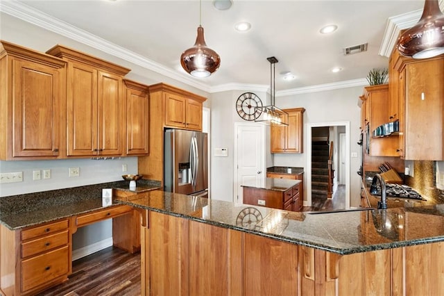 1037 Scarlet Oak Ln, Mandeville, LA 70448 - kitchen with stainless steel fridge with ice dispenser, brown cabinetry, dark wood-type flooring, crown molding, and dark stone countertops