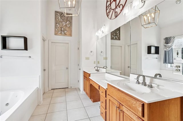 1037 Scarlet Oak Ln, Mandeville, LA 70448 - full bathroom with a chandelier, tile patterned floors, a whirlpool tub, and double vanity