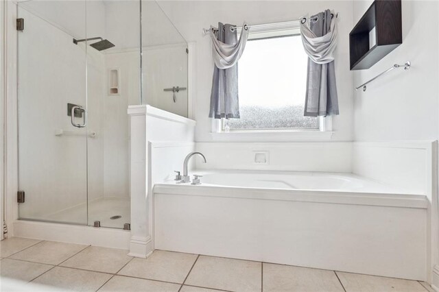 1037 Scarlet Oak Ln, Mandeville, LA 70448 - bathroom featuring a shower stall, a garden tub, and tile patterned floors