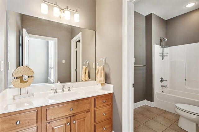 1037 Scarlet Oak Ln, Mandeville, LA 70448 - bathroom with toilet, vanity, tile patterned floors,  shower combination, and baseboards