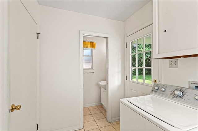 213 N Jayson Dr, Slidell, LA 70458 - laundry room featuring washer / clothes dryer, light tile patterned floors, baseboards, and cabinet space