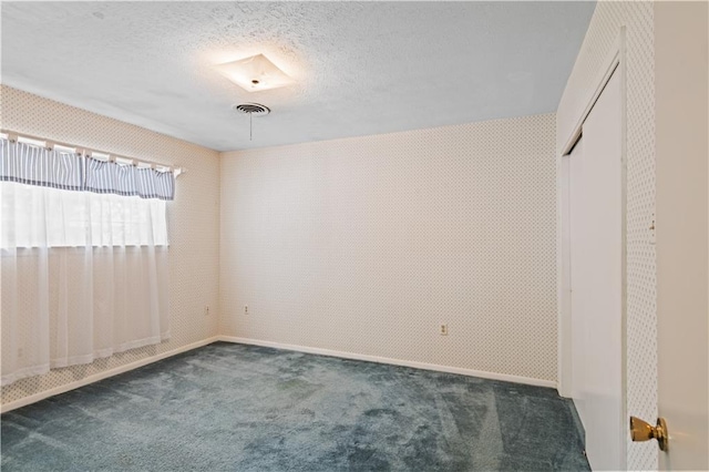 213 N Jayson Dr, Slidell, LA 70458 - unfurnished bedroom featuring carpet flooring, baseboards, a closet, and a textured ceiling