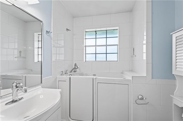 213 N Jayson Dr, Slidell, LA 70458 - full bath featuring tile walls and vanity