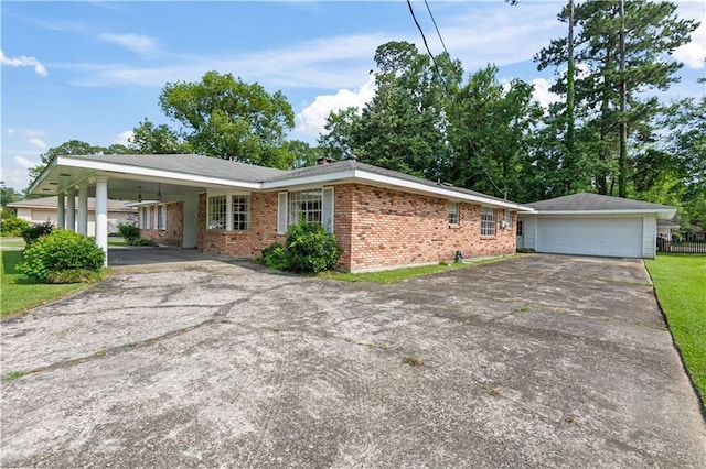 213 N Jayson Dr, Slidell, LA 70458 - single story home featuring asphalt driveway, brick siding, and a garage