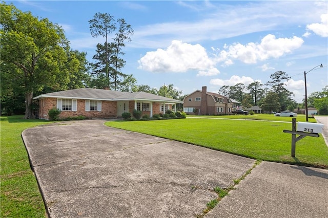 213 N Jayson Dr, Slidell, LA 70458 - single story home featuring a front yard, brick siding, and concrete driveway