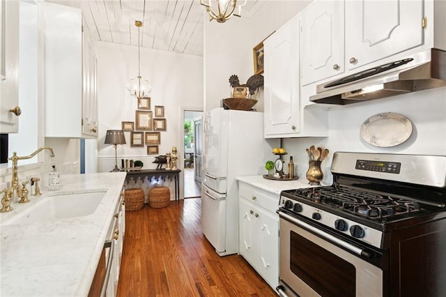 505 W 14th Ave, Covington, LA 70433 - kitchen featuring gas range, a sink, under cabinet range hood, white cabinets, and a chandelier