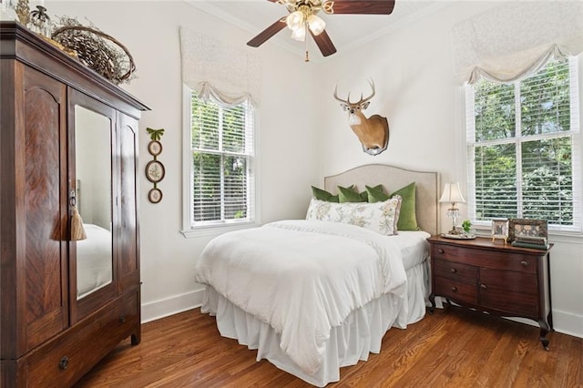 505 W 14th Ave, Covington, LA 70433 - bedroom with ornamental molding, dark wood-style flooring, baseboards, and a ceiling fan