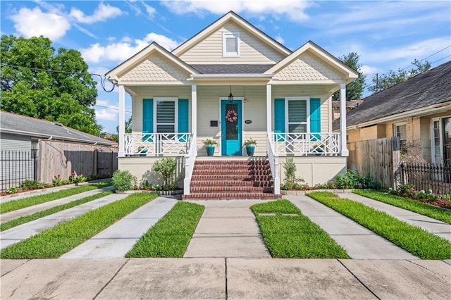 2828 Mistletoe St, New Orleans, LA 70118 - view of front facade featuring a porch