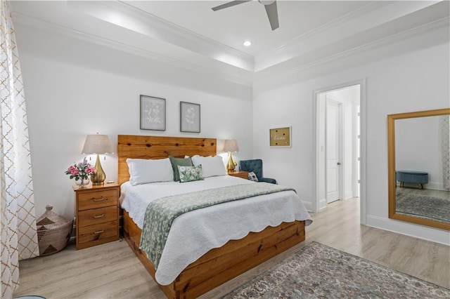 2828 Mistletoe St, New Orleans, LA 70118 - bedroom featuring light wood finished floors, a raised ceiling, crown molding, a ceiling fan, and recessed lighting