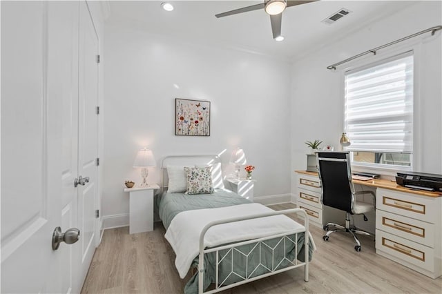 2828 Mistletoe St, New Orleans, LA 70118 - bedroom featuring an office area, light wood-style floors, multiple windows, recessed lighting, and crown molding