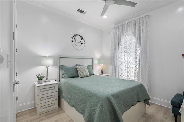 2828 Mistletoe St, New Orleans, LA 70118 - bedroom with ornamental molding, wood finished floors, baseboards, and a ceiling fan
