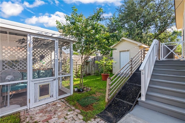 2828 Mistletoe St, New Orleans, LA 70118 - view of yard featuring stairway and a sunroom