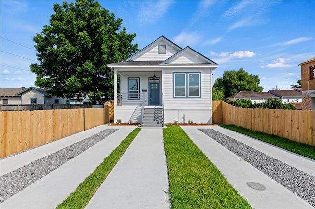 3414 Monroe St, New Orleans, LA 70118 - bungalow-style house featuring driveway and covered porch