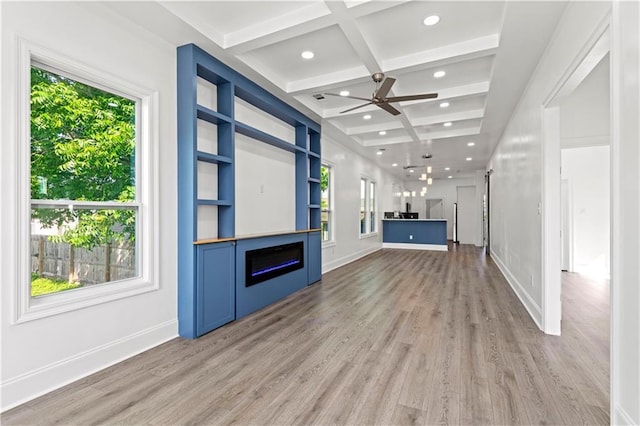 3414 Monroe St, New Orleans, LA 70118 - unfurnished living room with coffered ceiling, light wood-style floors, a fireplace, beam ceiling, and recessed lighting