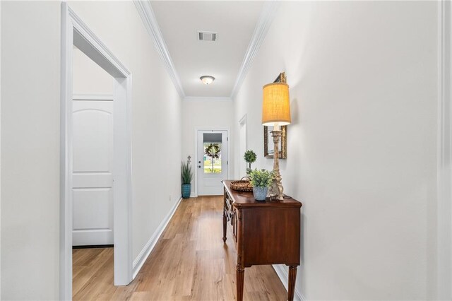 22039 Giselle Dr, Mandeville, LA 70471 - hallway featuring ornamental molding, light wood-style flooring, and baseboards