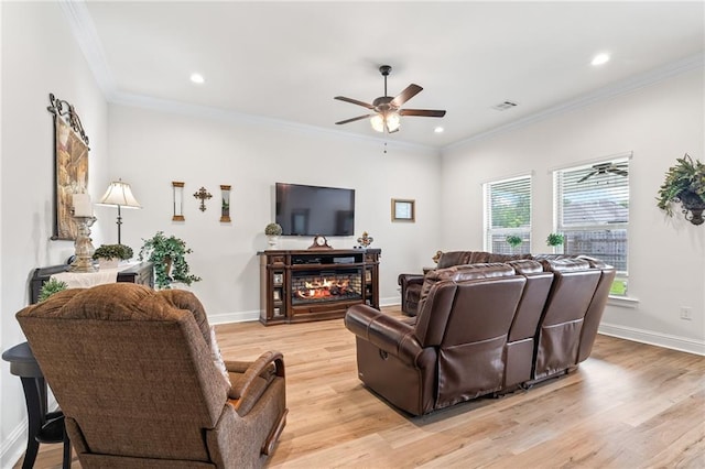 22039 Giselle Dr, Mandeville, LA 70471 - living room featuring a ceiling fan, light wood-style floors, ornamental molding, recessed lighting, and baseboards