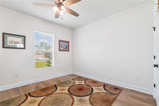 22039 Giselle Dr, Mandeville, LA 70471 - empty room featuring wood finished floors, baseboards, and ceiling fan