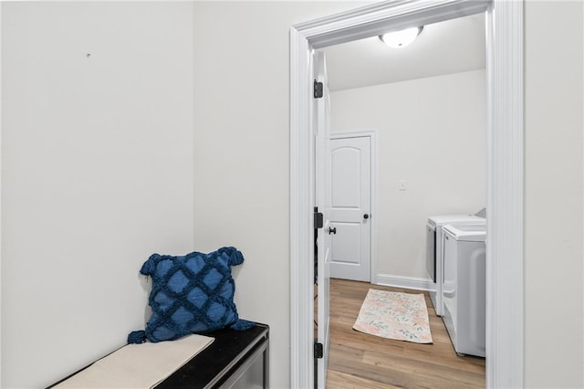 22039 Giselle Dr, Mandeville, LA 70471 - washroom featuring light wood-type flooring and washer and dryer