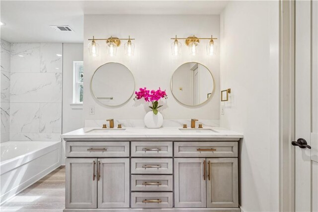 21507 Birtrue Rd, Bush, LA 70431 - bathroom featuring a bath, double vanity, wood finished floors, and a shower
