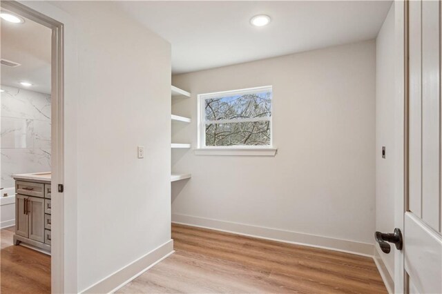 21507 Birtrue Rd, Bush, LA 70431 - walk in closet featuring light wood-style flooring