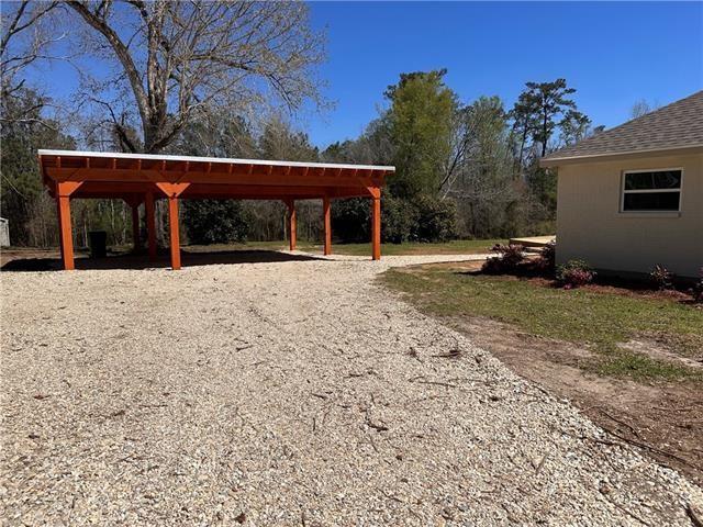 21507 Birtrue Rd, Bush, LA 70431 - view of property's community with gravel driveway and a detached carport