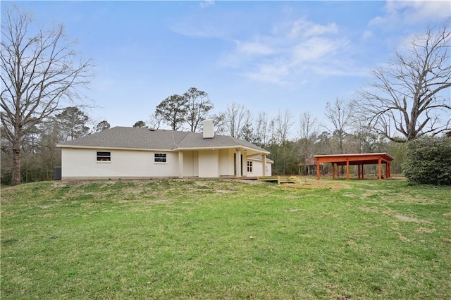 21507 Birtrue Rd, Bush, LA 70431 - back of property with a lawn and a chimney