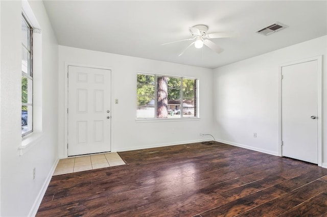 106 Walnut St, Mandeville, LA 70471 - foyer entrance with wood finished floors, ceiling fan, and baseboards