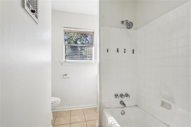 106 Walnut St, Mandeville, LA 70471 - full bathroom featuring toilet, tile patterned flooring, washtub / shower combination, and baseboards