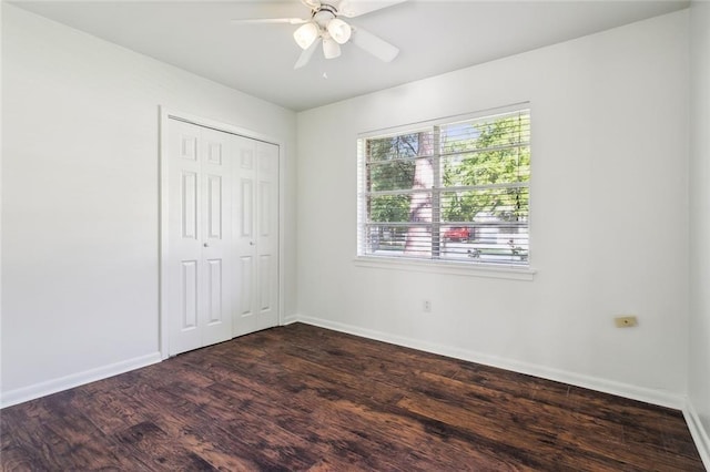 106 Walnut St, Mandeville, LA 70471 - unfurnished bedroom featuring baseboards, dark wood-style floors, a closet, and ceiling fan