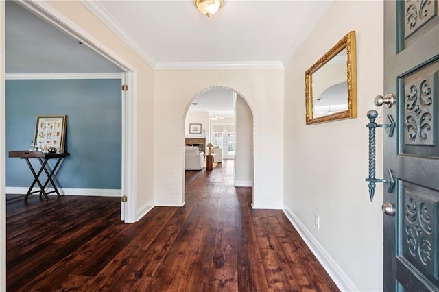 15 Forstall Ave, Kenner, LA 70065 - foyer entrance featuring arched walkways, hardwood / wood-style floors, crown molding, and baseboards
