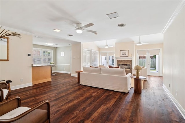 15 Forstall Ave, Kenner, LA 70065 - living room with a ceiling fan, dark wood finished floors, baseboards, a fireplace, and ornamental molding