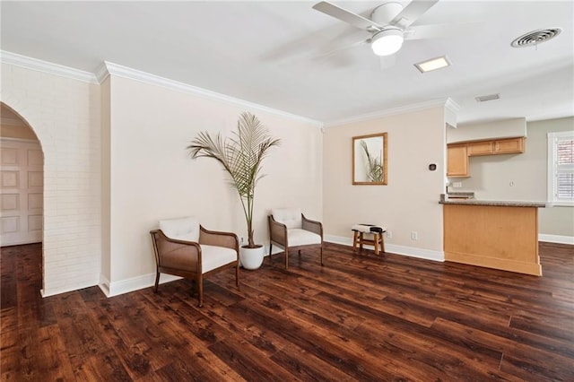 15 Forstall Ave, Kenner, LA 70065 - sitting room with arched walkways, dark wood-type flooring, a ceiling fan, crown molding, and baseboards