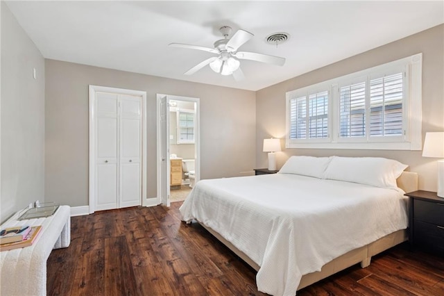 15 Forstall Ave, Kenner, LA 70065 - bedroom with dark wood finished floors, a ceiling fan, baseboards, ensuite bathroom, and a closet