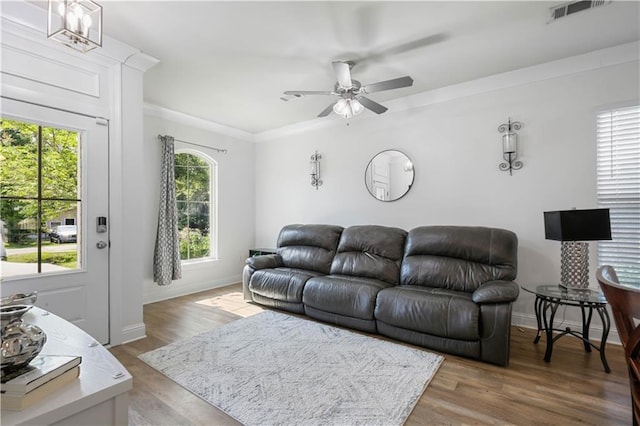 1951 Beth Dr, Slidell, LA 70458 - living area featuring healthy amount of natural light, ceiling fan, ornamental molding, and baseboards