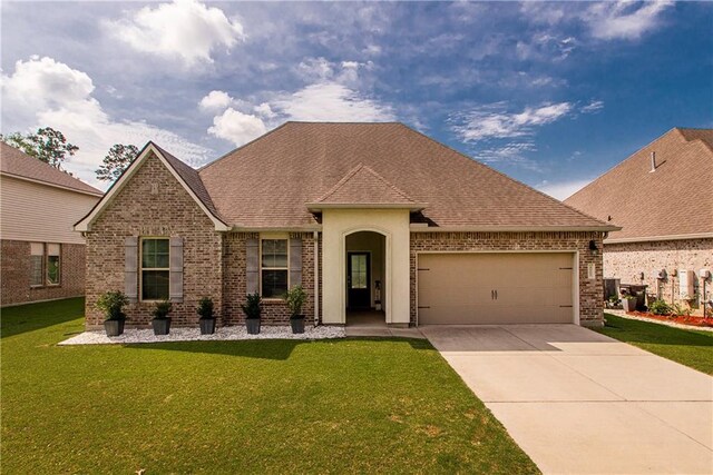 40262 Sedgwick Ln, Ponchatoula, LA 70454 - view of front of property with brick siding, an attached garage, driveway, and roof with shingles