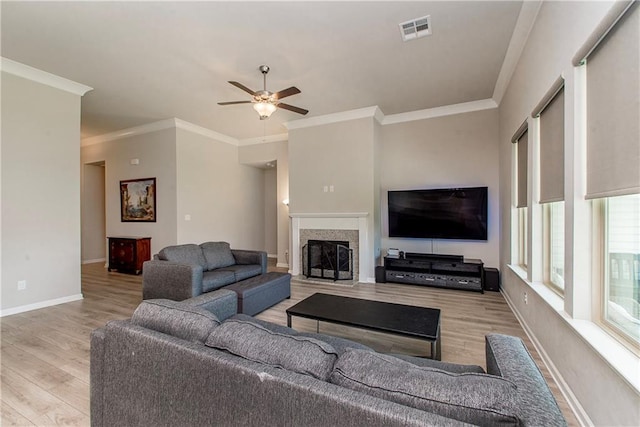 40262 Sedgwick Ln, Ponchatoula, LA 70454 - living room with wood finished floors, ceiling fan, crown molding, and a fireplace