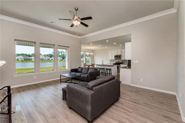40262 Sedgwick Ln, Ponchatoula, LA 70454 - living area with ceiling fan, crown molding, light wood-type flooring, a water view, and recessed lighting